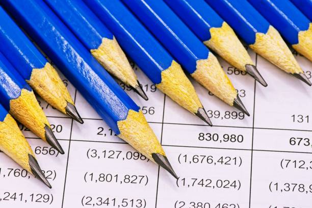sharp blue pencils on financial statement report. - mathematical symbol mathematics pencil sharp imagens e fotografias de stock