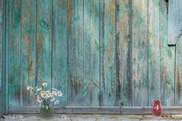 istock Charming still life with copy space strawberries and daisies on wood background 1215672548