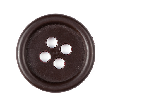 Clothes button isolated on white background. Copy space