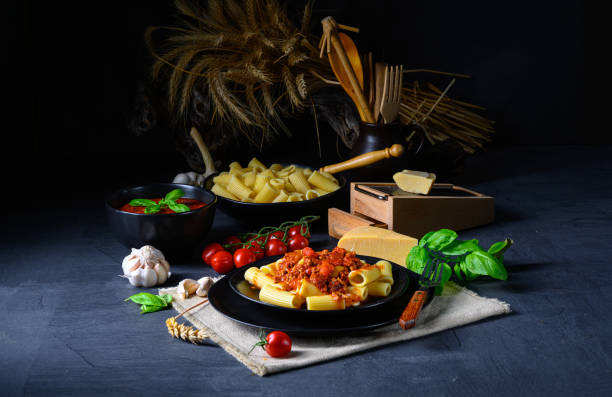 istock Rigatoni pasta with Bolognese sauce and fresh basil 1215674251