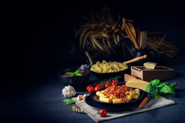 istock Rigatoni pasta with Bolognese sauce and fresh basil 1215674280