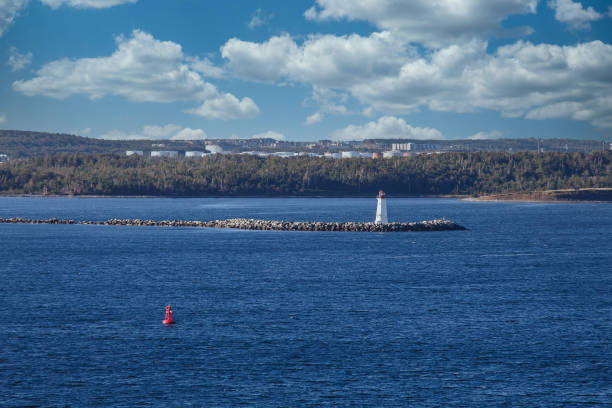 istock Beacon and Red Marker in Blue Water 1215676626