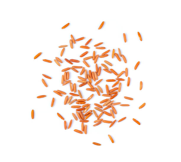 istock brown rice seeds isolated on white background. top view 1215676700