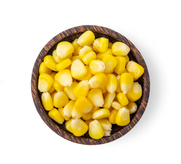 istock corn seeds in wood bowl isolated on white background. top view 1215676790