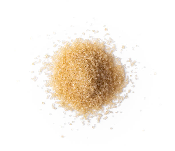 istock brown sugar isolated on white background. Top view 1215676991