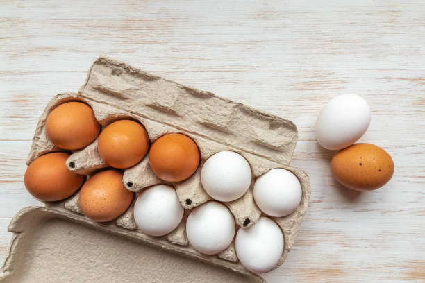 istock Free-range organic brown and white eggs in recycled cardboard box 1215678790