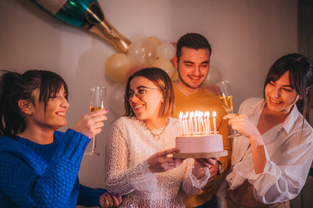 istock Friends celebration birthday with cake 1215679095