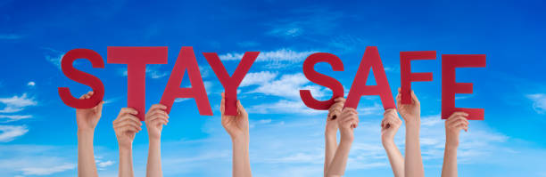 istock People Hands Holding Word Stay Safe, Blue Sky 1215679750
