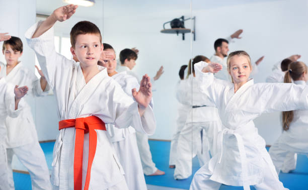 istock Children trying martial moves in karate class 1215679858