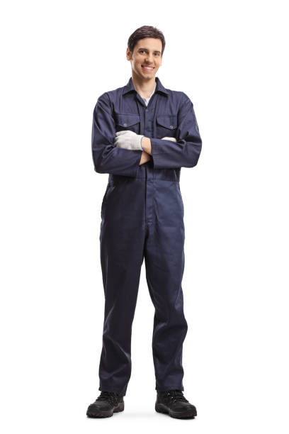 istock Male worker in a uniform smiling and posing with crossed arms 1215679937
