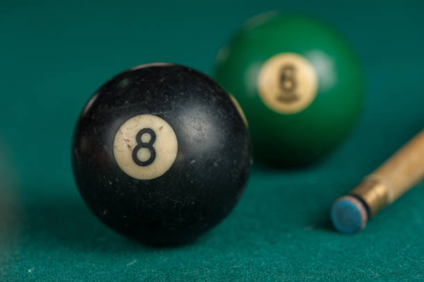 istock Billiards balls and cue on billiards table. Billiard sport concept 1215680044