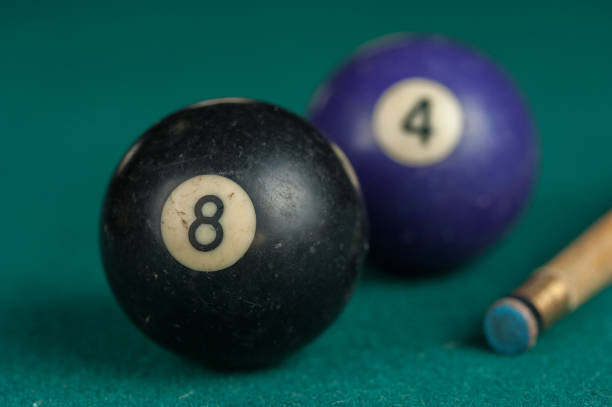 istock Billiards balls and cue on billiards table. Billiard sport concept 1215680217
