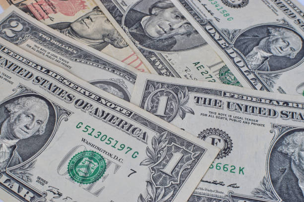 istock the background of us dollar bills is scattered on the table 1215680601