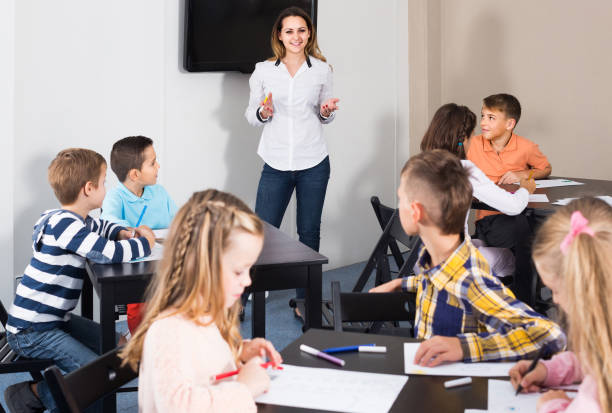 istock Children of elementary age having class of art 1215680745