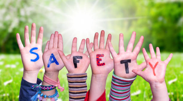 istock Children Hands Building Word Safety, Grass Meadow 1215680837