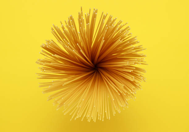 Spaghetti top view on a yellow background