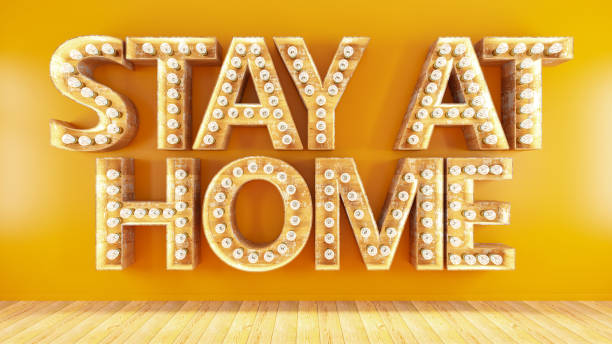 istock Stay at Home Sign with Light Bulbs Quarantine Concept 1215682845