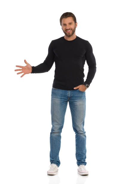 istock Confident Man Is Standing And Showing Open Hand 1215683519