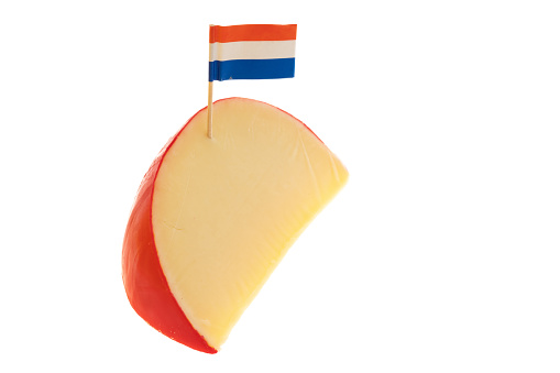 Slice of Edam cheese with a small Dutch flag - white background