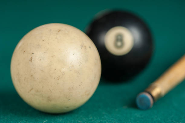 istock Billiards balls and cue on billiards table. Billiard sport concept 1215683612