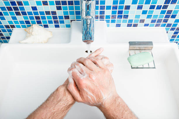 istock Person washing hands protective measures against coronavirus germ and bacteria spreading 1215683834