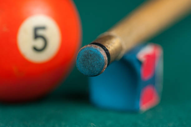 istock Billiards balls and cue on billiards table. Billiard sport concept 1215683917