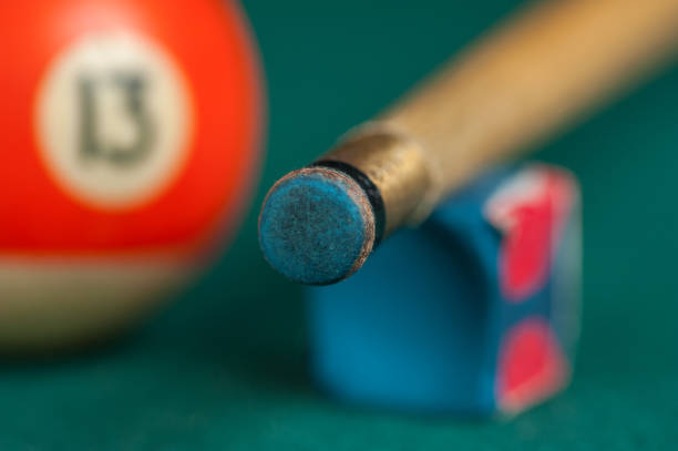 istock Billiards balls and cue on billiards table. Billiard sport concept 1215684043