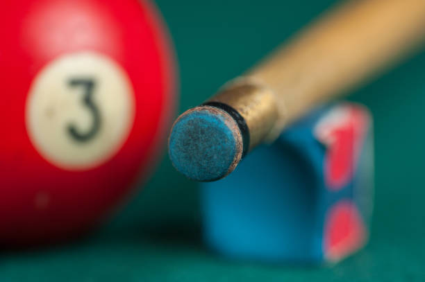 istock Billiards balls and cue on billiards table. Billiard sport concept 1215684087