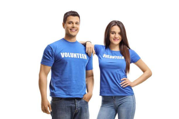Young volunteers in blue t-shirts posing Young volunteers in blue t-shirts posing isolated on white background contributor stock pictures, royalty-free photos & images