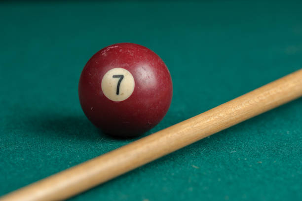 istock Billiards balls and cue on billiards table. Billiard sport concept 1215684280