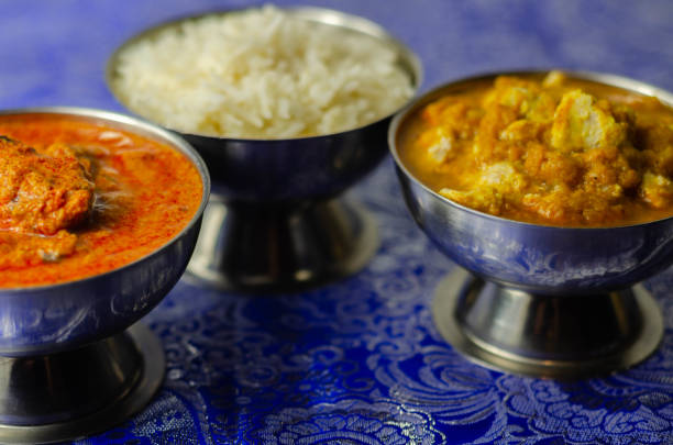 istock Mild chicken Korma and chicken Tikka Masala with Basmati rice 1215685310