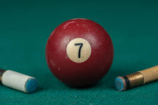 istock Billiards balls and cue on billiards table. Billiard sport concept 1215685355