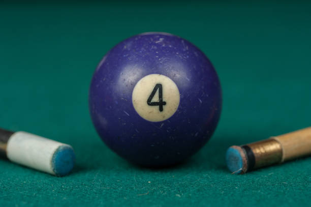 istock Billiards balls and cue on billiards table. Billiard sport concept 1215685467