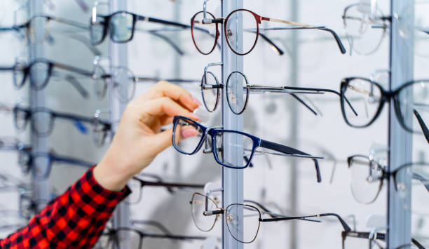 istock Woman's hand chooses glasses. 1215685606