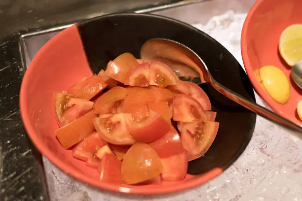 Delicious, tasty and healthy tomato salad on a  colorful plate