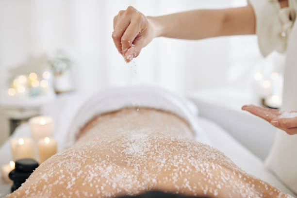 istock Beautician applying salt scrub 1215685699