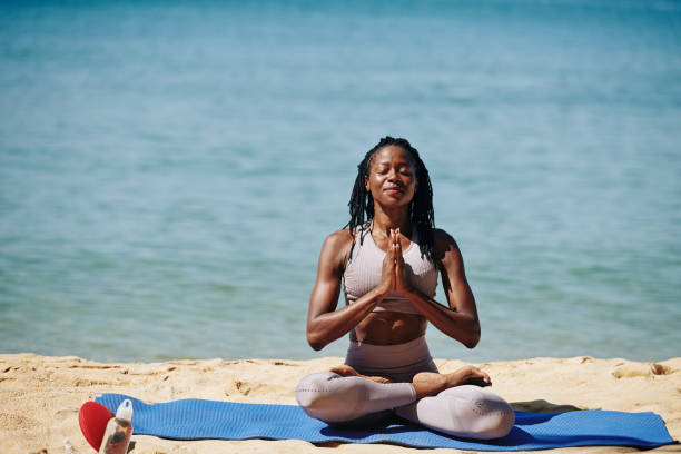 istock Smiling meditating woman 1215685823
