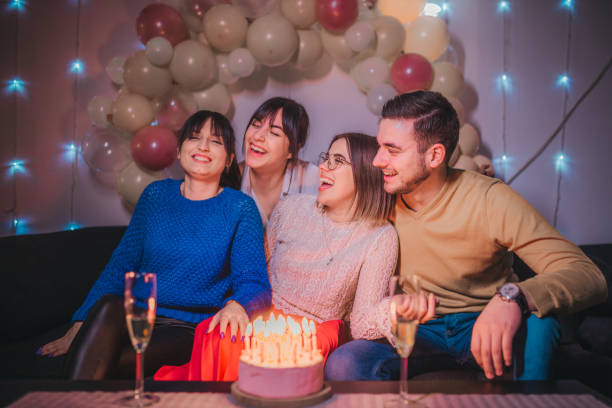 istock Friends celebration birthday with cake 1215685975