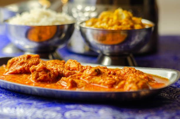 istock Mild chicken Korma and chicken Tikka Masala with Basmati rice 1215686284