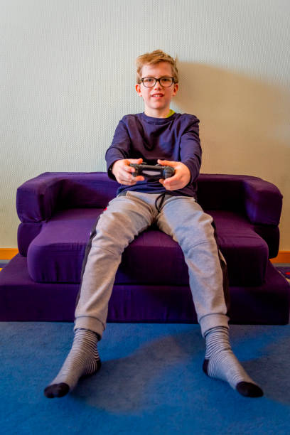 istock teenager playing computer games 1215686409
