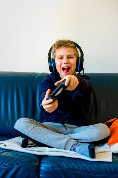 istock teenager playing computer games 1215687574