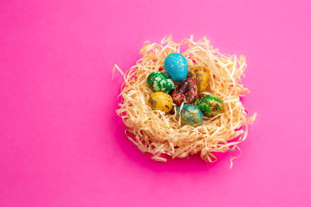 istock Painted easter eggs lie in a nest of shavings 1215687942