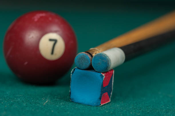 istock Billiards balls and cue on billiards table. Billiard sport concept 1215688062