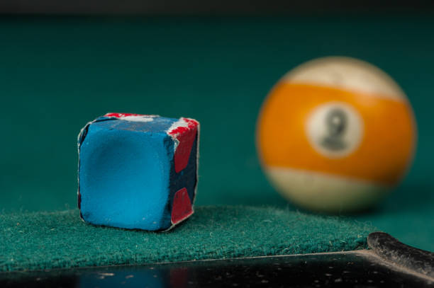 Billiards balls and cue on billiards table. Billiard sport concept