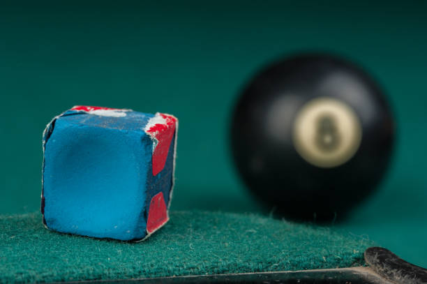 istock Billiards balls and cue on billiards table. Billiard sport concept 1215688418