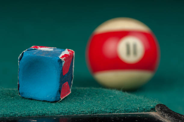 istock Billiards balls and cue on billiards table. Billiard sport concept 1215688496