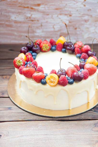 istock Cheesecake with white chocolate, fresh berries, strawberries, cherries, blueberries and raspberries on wooden background 1215688647