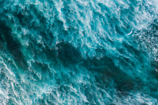 istock Big ocean waves hitting a coral rif. View from above. 1215688786