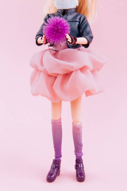istock The doll is holding abstract virus strain model coronavirus covid-19 1215688802