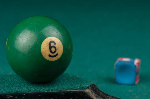 istock Billiards balls and cue on billiards table. Billiard sport concept 1215688818